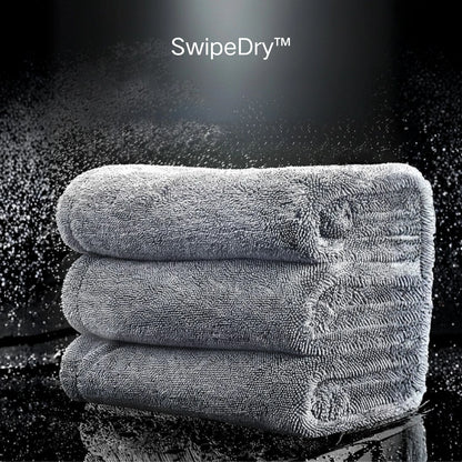 Large 24x80 inch microfiber drying towel drying an SUV hood in one pass without streaks.